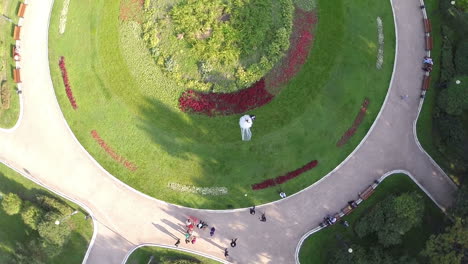Aerial-shot-of-newlyweds-in-green-park-and-Moscow-view